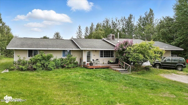 701 N Luke St, Wasilla, AK 99654 - ranch-style home featuring a chimney, a deck, and a front lawn