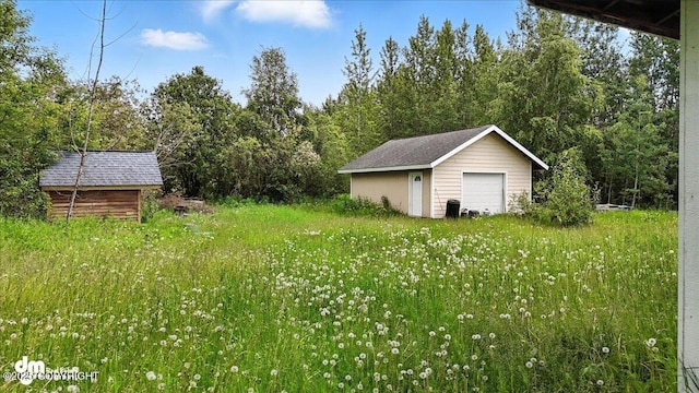 701 N Luke St, Wasilla, AK 99654 - view of yard with a detached garage and an outdoor structure