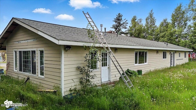 701 N Luke St, Wasilla, AK 99654 - view of side of home featuring roof with shingles