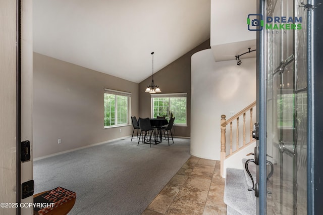 11240 E Equestrian St, Palmer, AK 99645 - carpeted entrance foyer with high vaulted ceiling, stairs, a chandelier, and stone finish floors