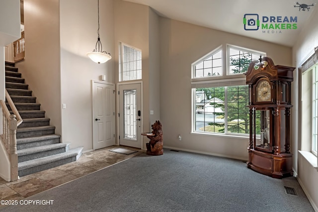 11240 E Equestrian St, Palmer, AK 99645 - carpeted foyer with a high ceiling, plenty of natural light, and stairway