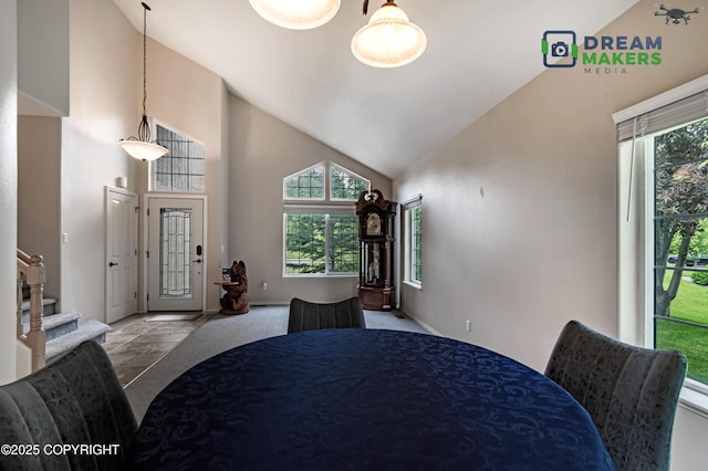 11240 E Equestrian St, Palmer, AK 99645 - dining area featuring high vaulted ceiling and stairs
