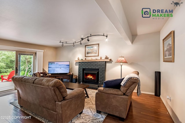 11240 E Equestrian St, Palmer, AK 99645 - living room with wood finished floors, a brick fireplace, and track lighting