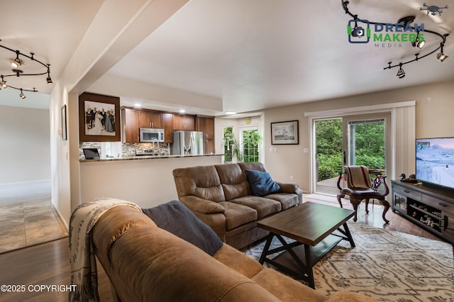 11240 E Equestrian St, Palmer, AK 99645 - living room with rail lighting, wood finished floors, and recessed lighting