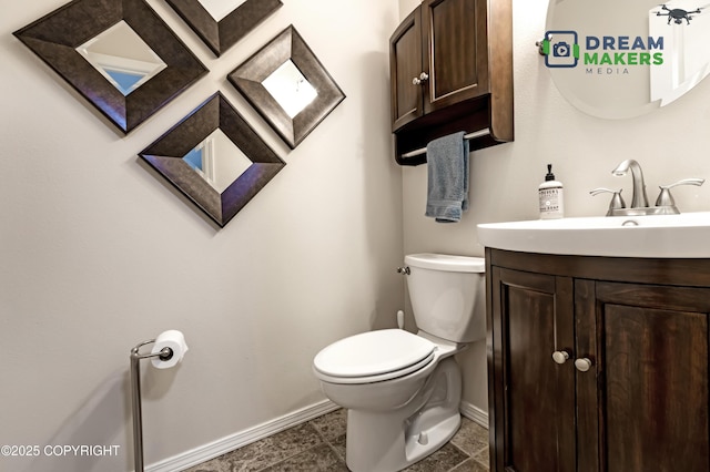 11240 E Equestrian St, Palmer, AK 99645 - bathroom featuring baseboards and vanity