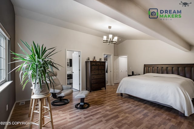 11240 E Equestrian St, Palmer, AK 99645 - bedroom with wood finished floors, vaulted ceiling, a chandelier, multiple windows, and ensuite bathroom