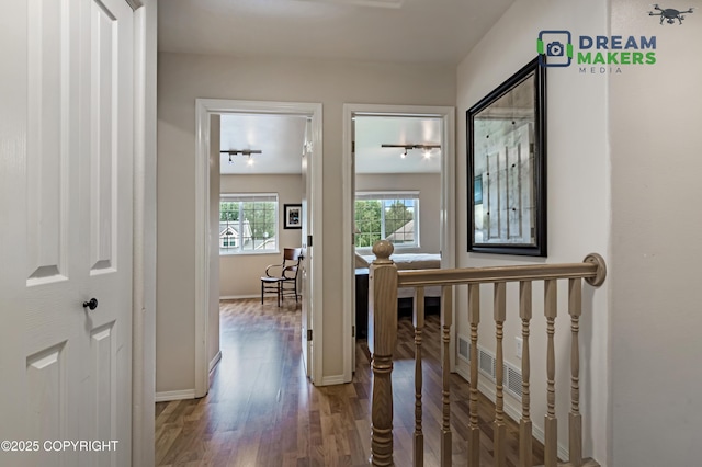 11240 E Equestrian St, Palmer, AK 99645 - corridor featuring an upstairs landing, wood finished floors, and track lighting