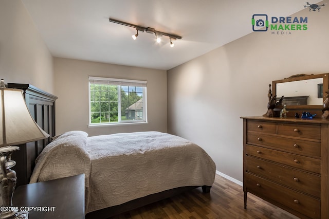 11240 E Equestrian St, Palmer, AK 99645 - bedroom featuring track lighting and dark wood finished floors