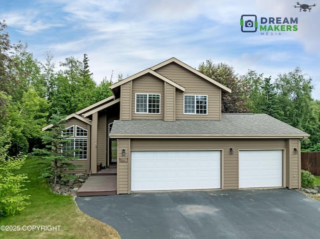 11240 E Equestrian St, Palmer, AK 99645 - view of front of house with asphalt driveway, a front lawn, and roof with shingles