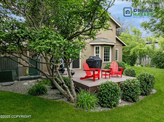 11240 E Equestrian St, Palmer, AK 99645 - rear view of property with a deck and a lawn
