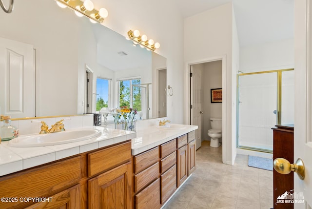 10100 Zermatt Cir, Anchorage, AK 99507 - full bathroom with double vanity, a stall shower, and tile patterned flooring