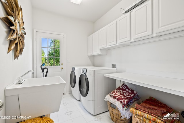 10100 Zermatt Cir, Anchorage, AK 99507 - laundry room with cabinet space and washer and dryer