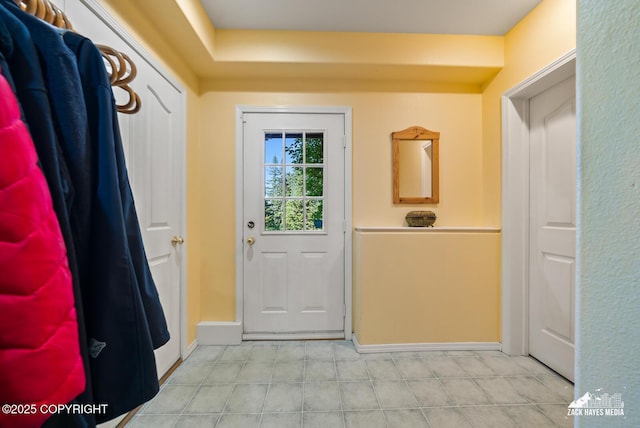 10100 Zermatt Cir, Anchorage, AK 99507 - doorway to outside featuring baseboards