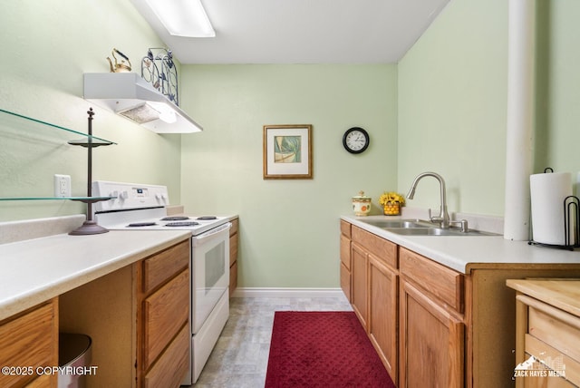 10100 Zermatt Cir, Anchorage, AK 99507 - kitchen with electric stove, light countertops, under cabinet range hood, and brown cabinets