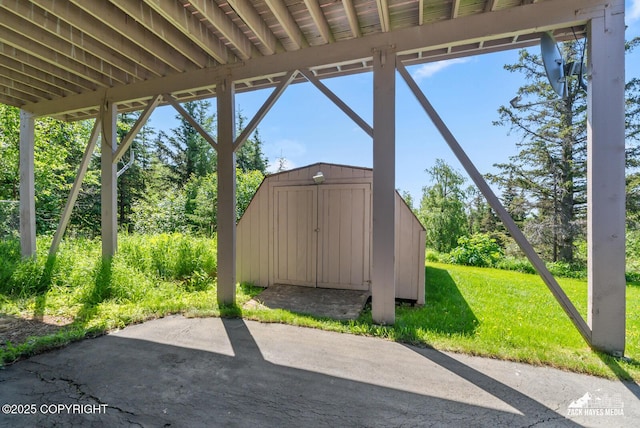 10100 Zermatt Cir, Anchorage, AK 99507 - view of patio with a storage shed