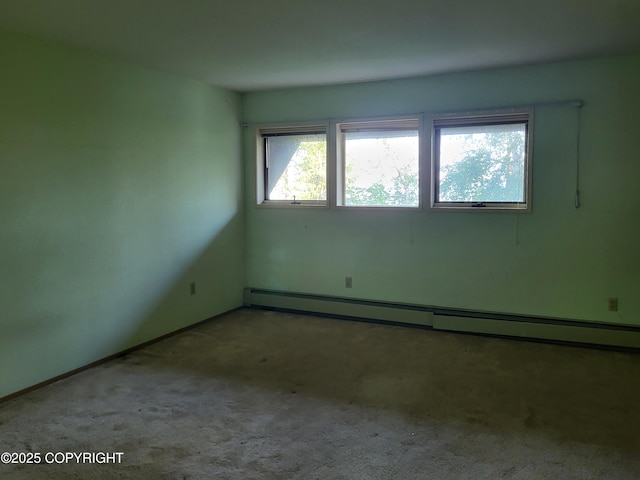 9921 Nearpoint Dr, Anchorage, AK 99507 - carpeted spare room featuring a baseboard radiator and baseboards