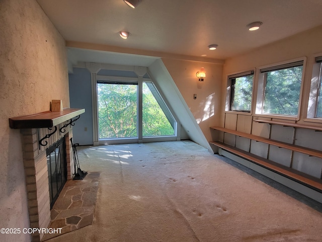 9921 Nearpoint Dr, Anchorage, AK 99507 - bonus room with a fireplace, carpet floors, a baseboard radiator, and recessed lighting