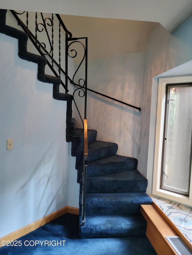 9921 Nearpoint Dr, Anchorage, AK 99507 - stairs featuring carpet flooring and baseboards