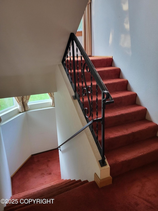 9921 Nearpoint Dr, Anchorage, AK 99507 - stairs featuring carpet floors
