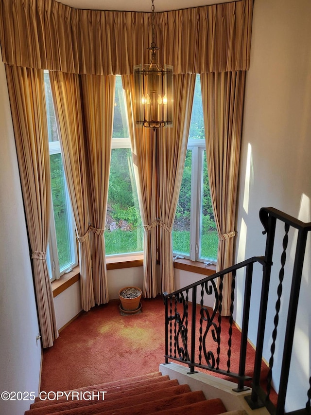 9921 Nearpoint Dr, Anchorage, AK 99507 - stairs with carpet and a chandelier