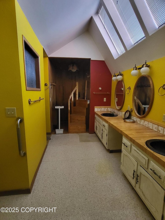 9921 Nearpoint Dr, Anchorage, AK 99507 - bathroom featuring a sink and lofted ceiling