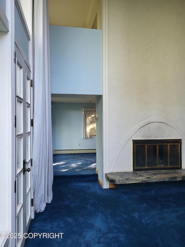 9921 Nearpoint Dr, Anchorage, AK 99507 - corridor featuring carpet floors and a baseboard heating unit