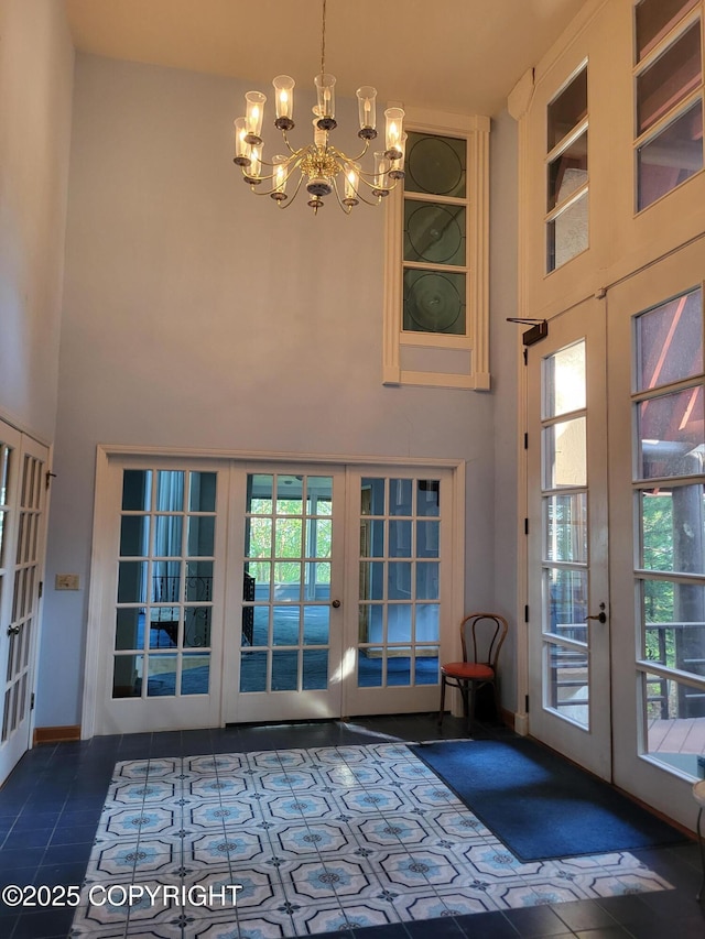 9921 Nearpoint Dr, Anchorage, AK 99507 - doorway to outside featuring french doors, a towering ceiling, a chandelier, tile patterned flooring, and plenty of natural light