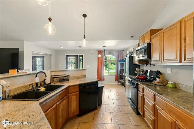 1708 Wesbet Ct, Kenai, AK 99611 - kitchen featuring black appliances, pendant lighting, and brown cabinetry