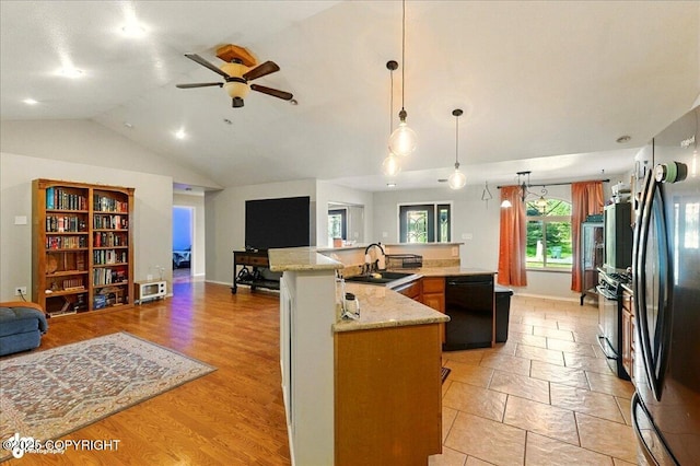 1708 Wesbet Ct, Kenai, AK 99611 - kitchen with dishwasher, open floor plan, freestanding refrigerator, vaulted ceiling, and a ceiling fan
