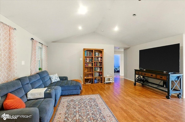1708 Wesbet Ct, Kenai, AK 99611 - living area featuring light wood-type flooring and lofted ceiling