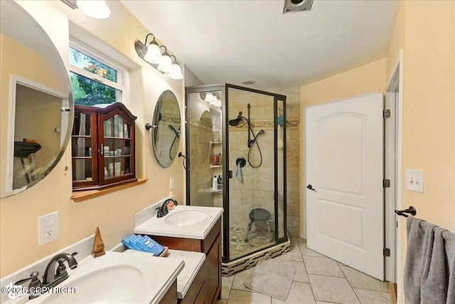 1708 Wesbet Ct, Kenai, AK 99611 - bathroom featuring a shower stall, two vanities, and tile patterned floors