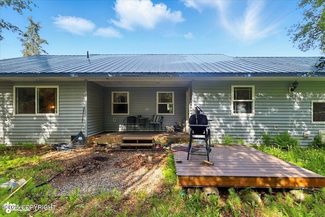 1708 Wesbet Ct, Kenai, AK 99611 - back of property with a metal roof and a deck