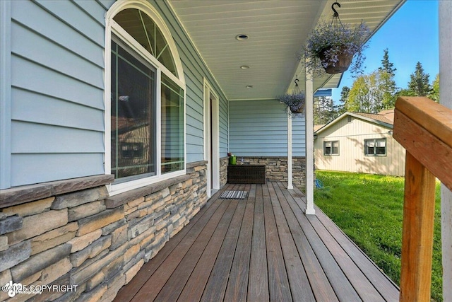 1708 Wesbet Ct, Kenai, AK 99611 - wooden porch featuring a lawn