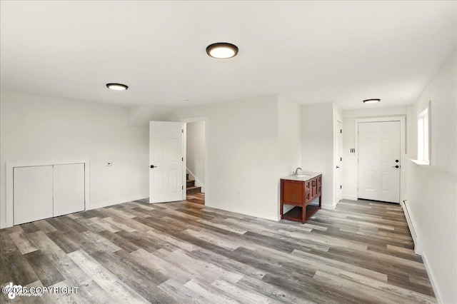 309 Stewart St, Anchorage, AK 99508 - unfurnished room with wood finished floors and stairs