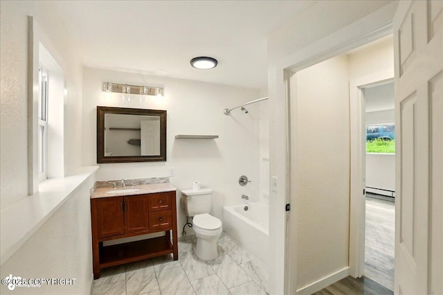 309 Stewart St, Anchorage, AK 99508 - bathroom featuring a baseboard radiator, vanity, and shower / bath combination
