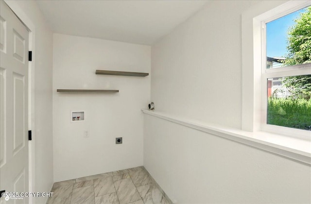 309 Stewart St, Anchorage, AK 99508 - laundry area with washer hookup, hookup for an electric dryer, and light marble finish flooring