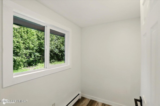 309 Stewart St, Anchorage, AK 99508 - empty room with dark wood-style flooring and baseboards