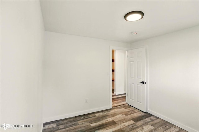 309 Stewart St, Anchorage, AK 99508 - spare room featuring wood finished floors and baseboards