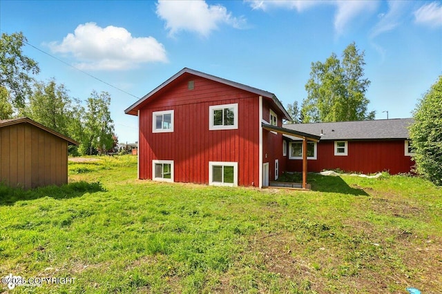 309 Stewart St, Anchorage, AK 99508 - back of property featuring a yard