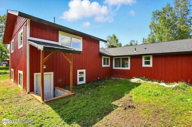309 Stewart St, Anchorage, AK 99508 - back of property with a lawn