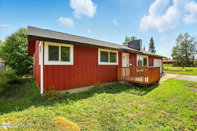 309 Stewart St, Anchorage, AK 99508 - view of front of property with a wooden deck and a front lawn