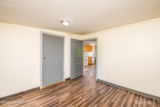 3521 N Caribou St, Wasilla, AK 99654 - empty room with dark wood-style flooring and baseboards