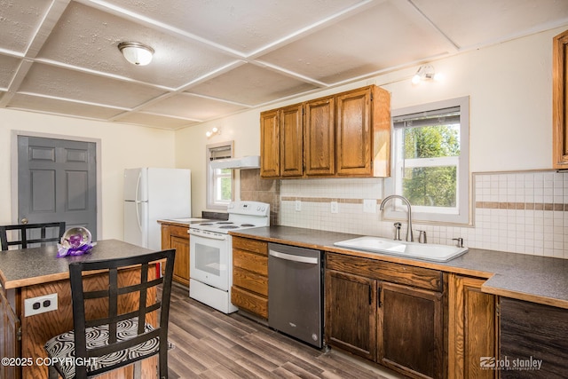 3521 N Caribou St, Wasilla, AK 99654 - kitchen with white appliances, dark wood-style flooring, plenty of natural light, and backsplash