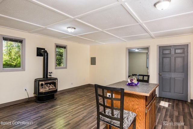 3521 N Caribou St, Wasilla, AK 99654 - dining space with coffered ceiling, dark wood-style flooring, and a wood stove