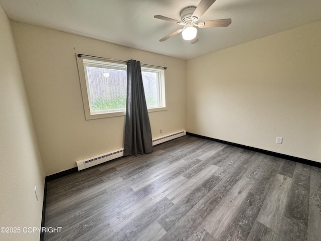 544 N Park St, Anchorage, AK 99508 - unfurnished room with baseboard heating, a ceiling fan, and wood finished floors