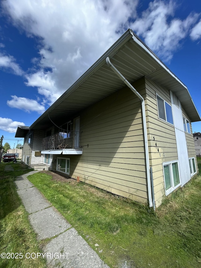544 N Park St, Anchorage, AK 99508 - view of property exterior with a lawn