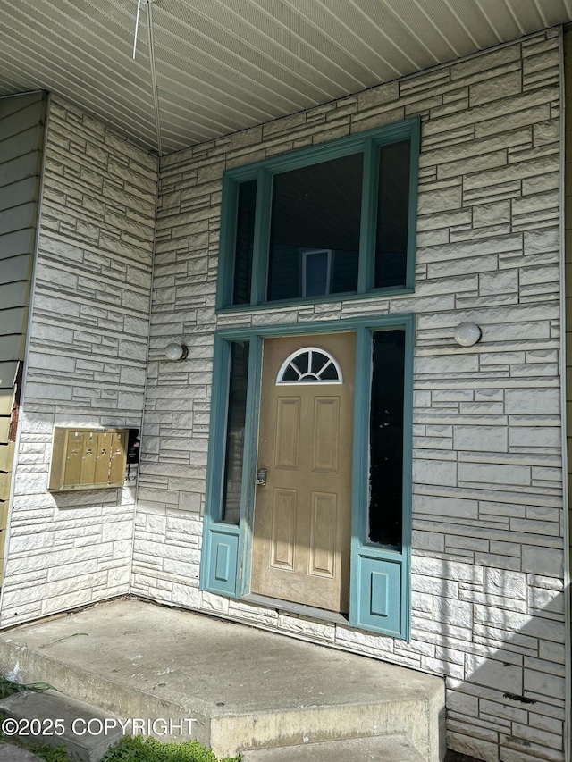 544 N Park St, Anchorage, AK 99508 - entrance to property with stone siding