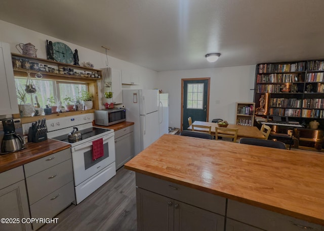 1245 N Miller Cir, Houston, AK 99623 - kitchen with butcher block counters, white appliances, dark wood-style flooring, and gray cabinets