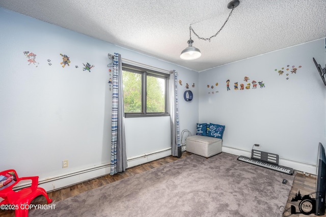 3501 N Calder Rd, Wasilla, AK 99654 - bedroom featuring a textured ceiling, wood finished floors, and a baseboard radiator