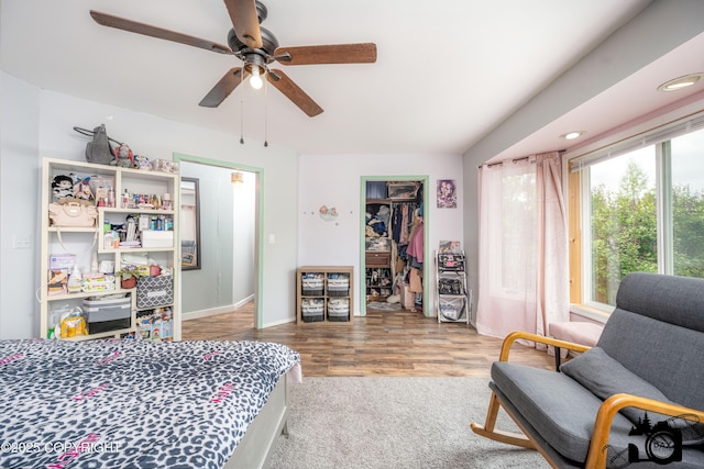 3501 N Calder Rd, Wasilla, AK 99654 - bedroom featuring a ceiling fan, wood finished floors, a closet, and a walk in closet